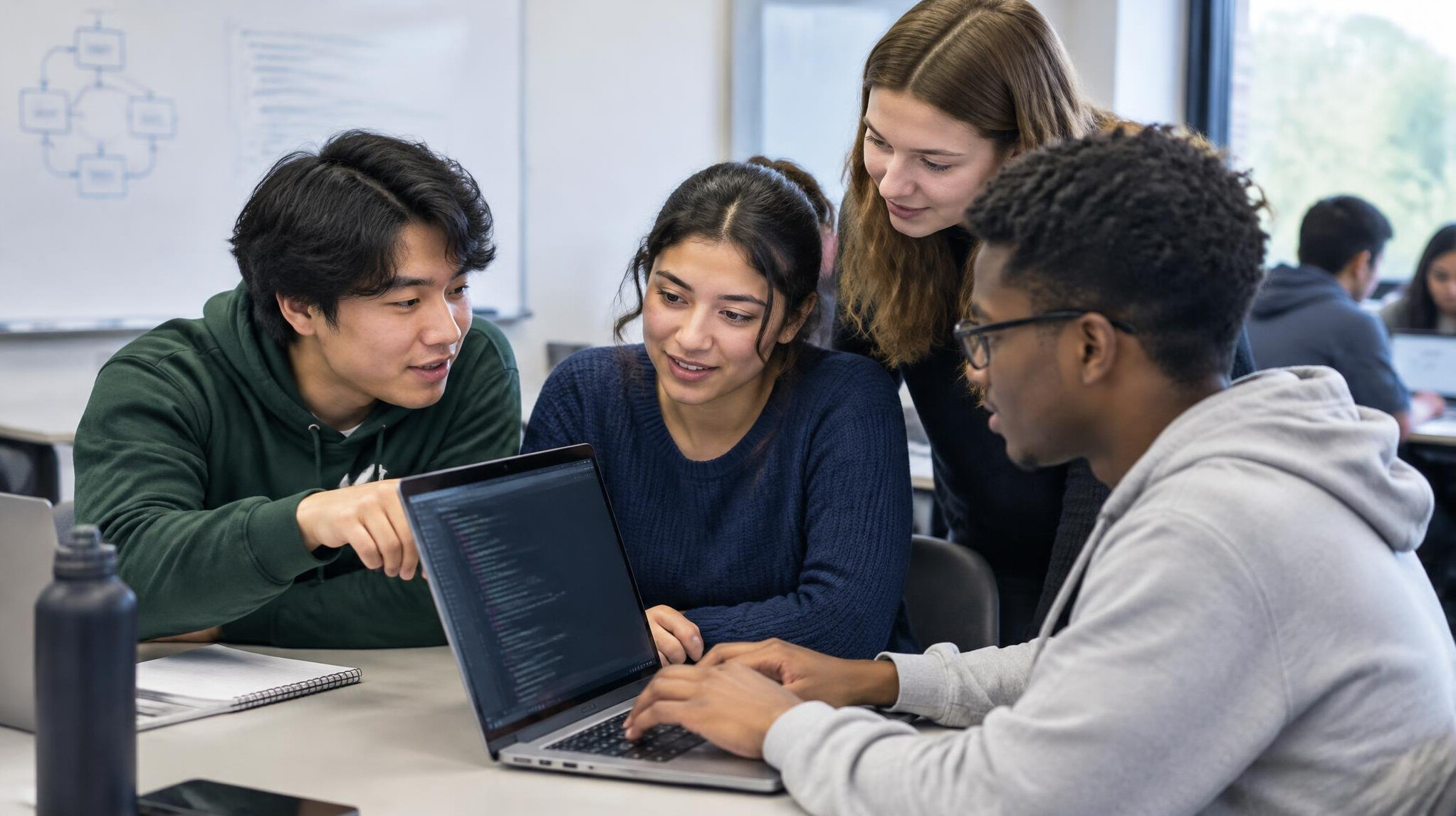 group of students discussing code